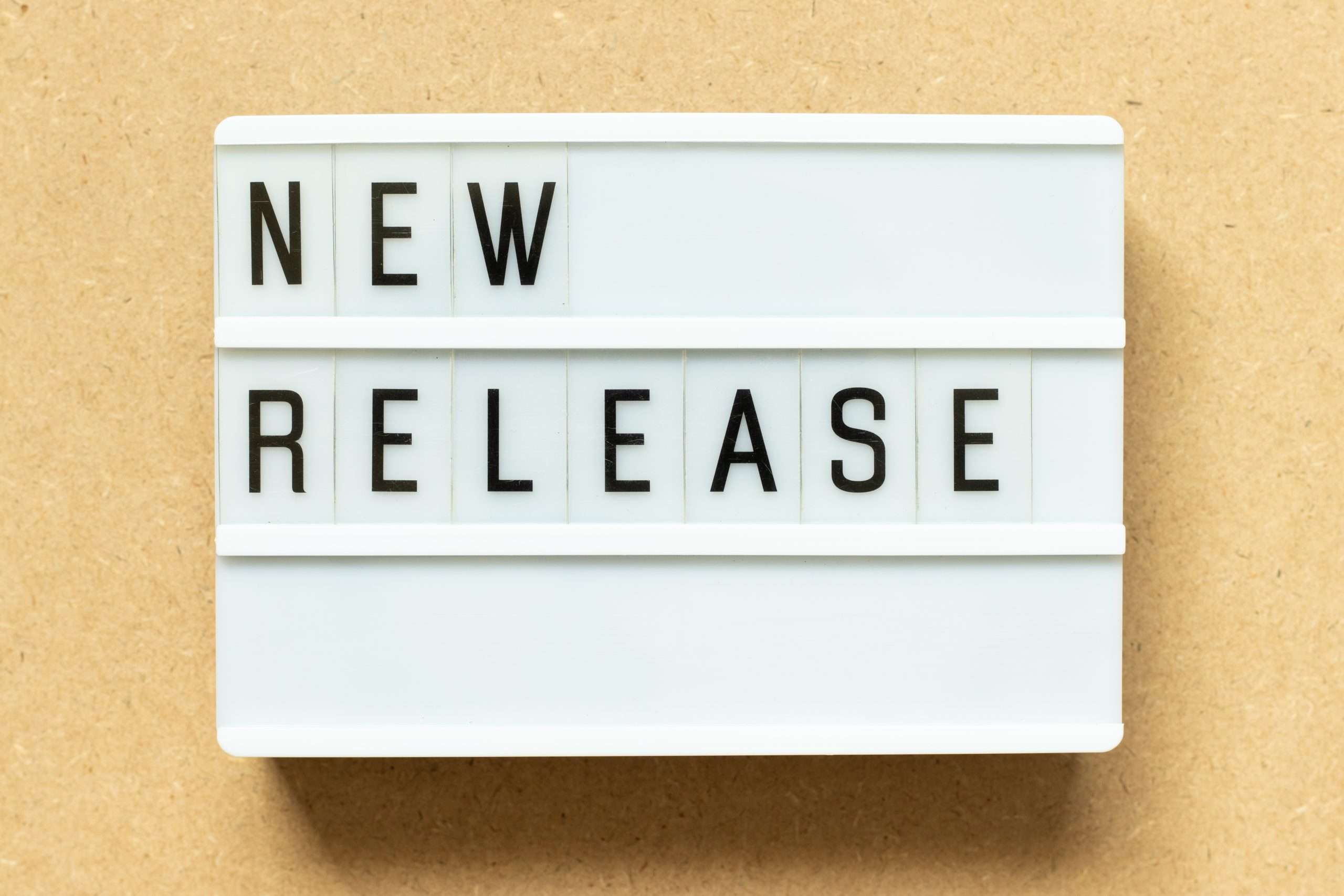 Lightbox,With,Word,New,Release,On,Wood,Background